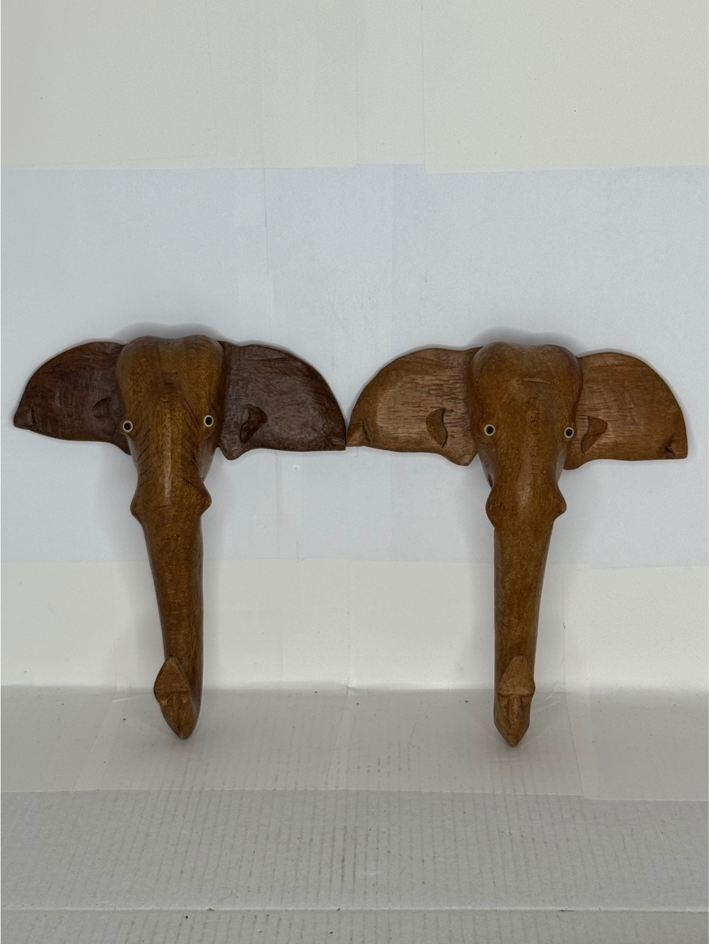Pair of carved wooden elephant wall hooks
